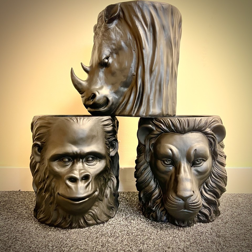 These planters are BLACK  Large African Animal Head Planters - Rhino, Gorilla, Lion