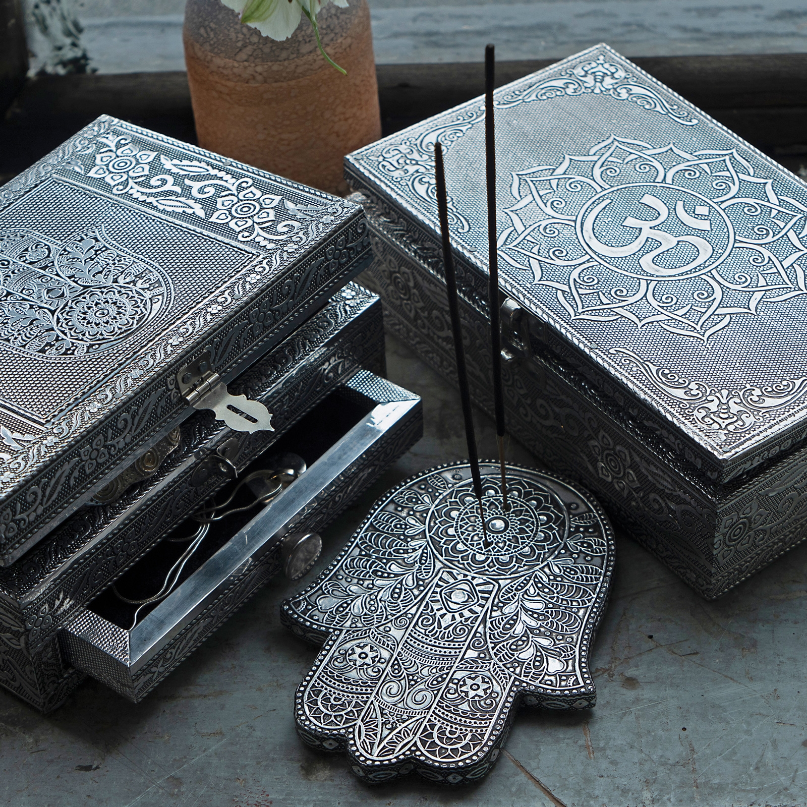 Click to view product details and reviews for Hamsa Incense Holder In Embossed Aluminium.