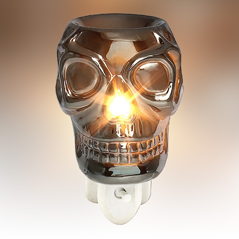 Click to view product details and reviews for Silver Skull Plug In Fragrance Warmer.